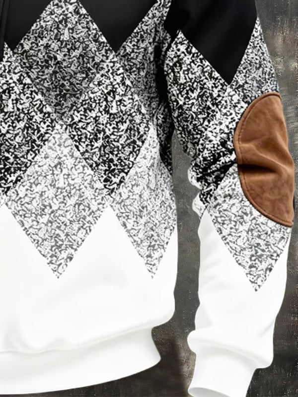 Close-up of the black and white speckled diamond pattern, ribbed hem and tan elbow patch 4