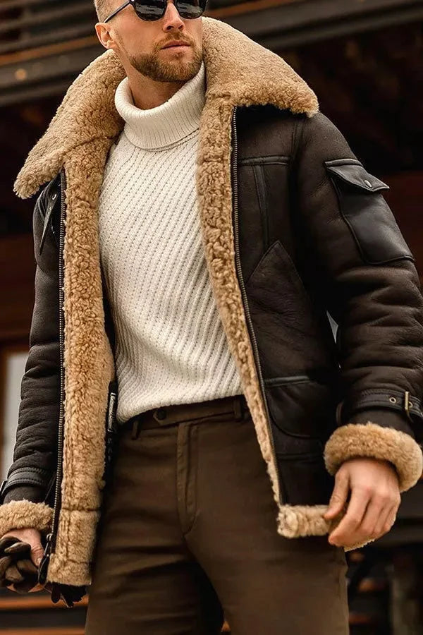 Dark brown version of the shearling jacket worn open, showing the tan fleece lining, pocket flap and cuff buckle 7