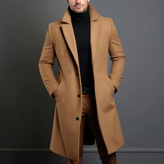 Model wearing the camel version of the longline coat with notch lapels and three buttons, styled with a black roll-neck. 2