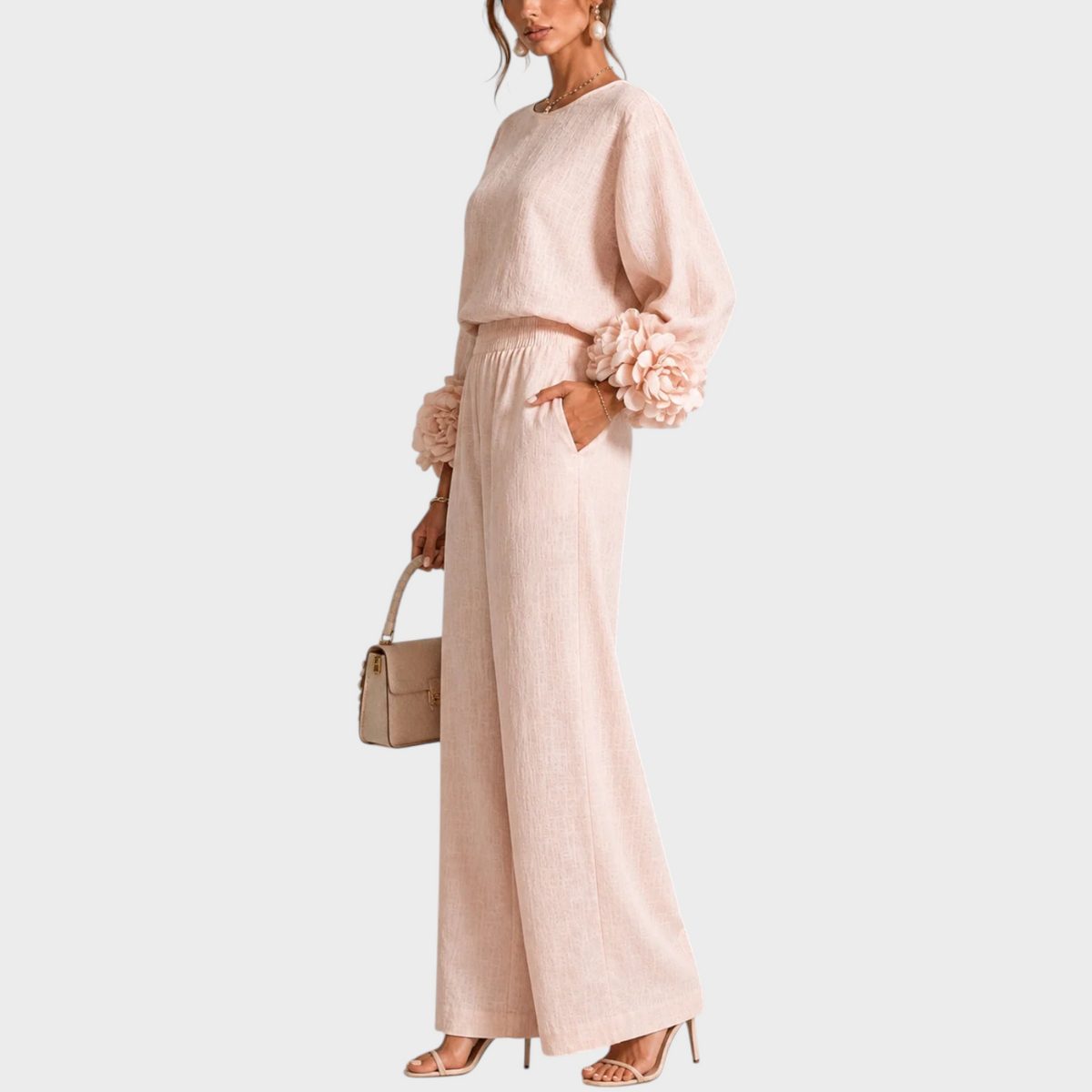 Side view of the blush pink set, with one hand in the pocket and rose cuffs visible 9