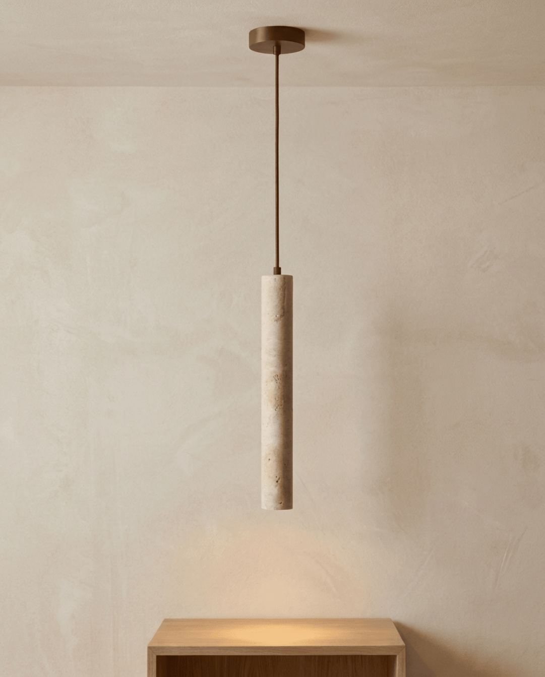 Full view of the pendant on a fabric cord, glowing softly above a wooden shelf 6