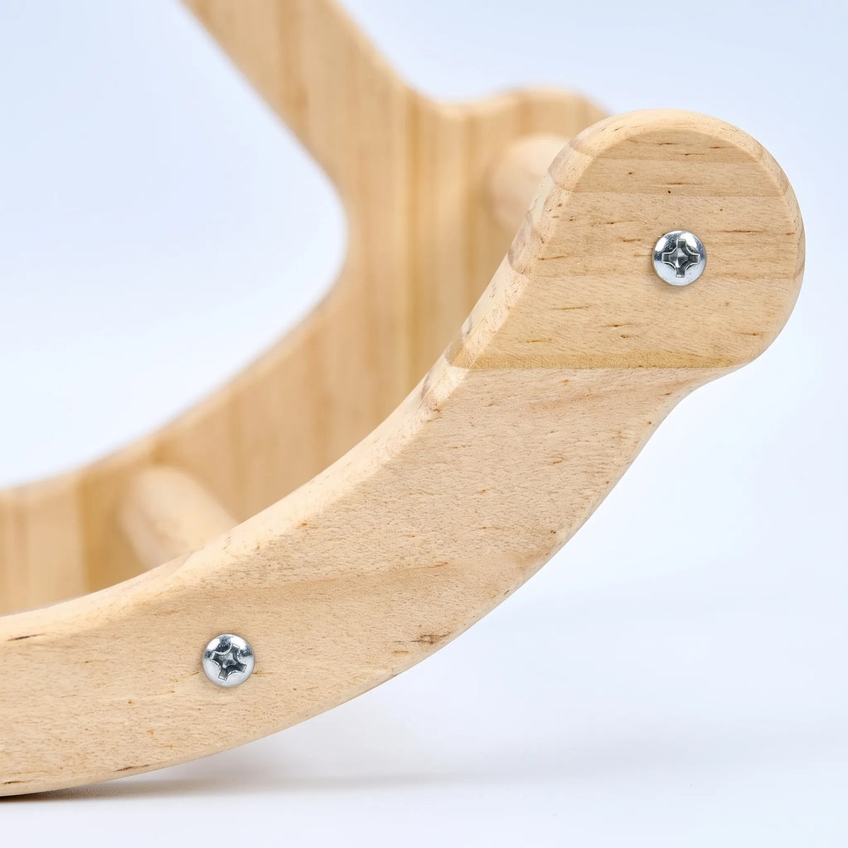 Close-up of the curved wooden perch end, showing the smooth pale grain, rounded tip and two silver screws. 3