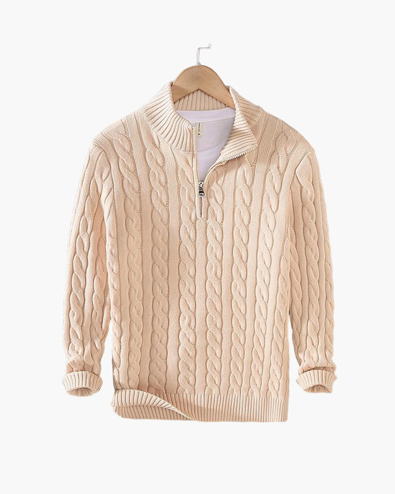 Beige cable knit half-zip jumper displayed on a wooden hanger with its sleeves slightly rolled and a white tee underneath. 20