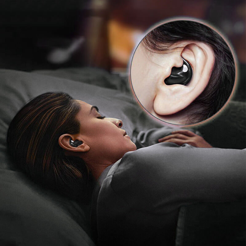 Woman lying on her side in bed wearing a black earbud, with a circular ear close-up 9