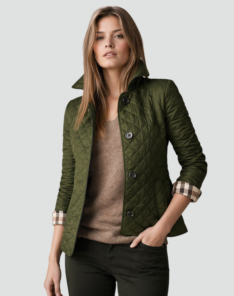 Model wearing the olive green quilted jacket with a standing collar and checked cuffs, over a brown jumper and dark trousers. 9