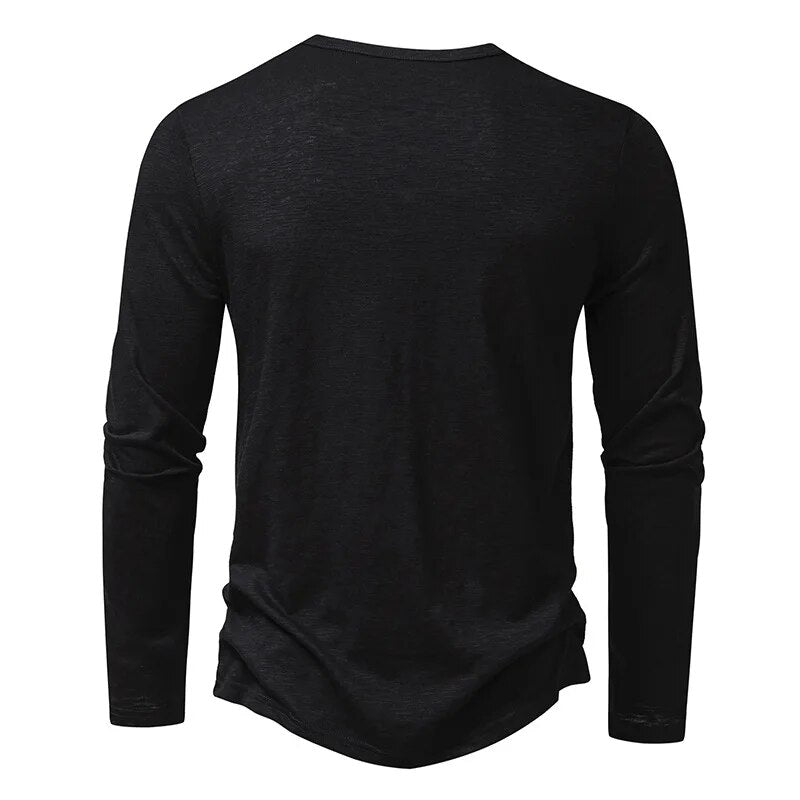 Back view of the black long-sleeved Henley, showing the plain back and round neckline. 17