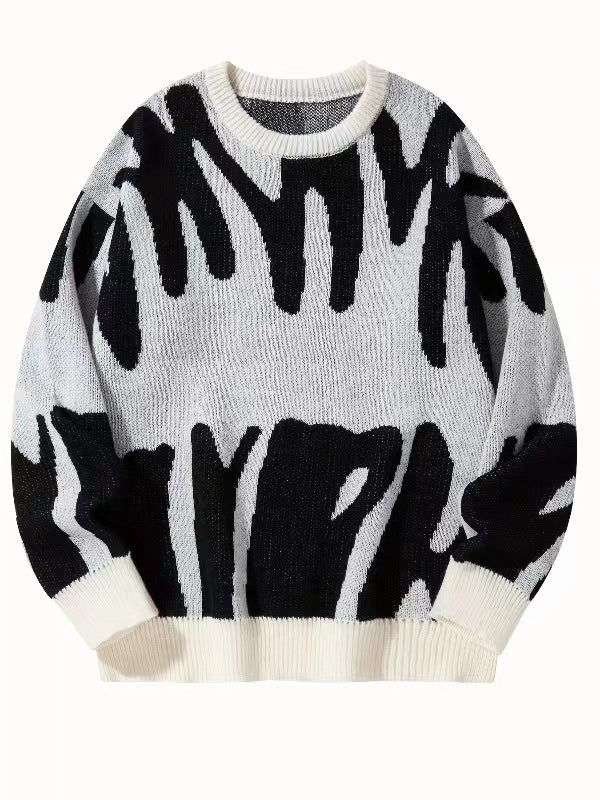 Flat-lay knit jumper in off-white with black abstract pattern and cream ribbed cuffs 6
