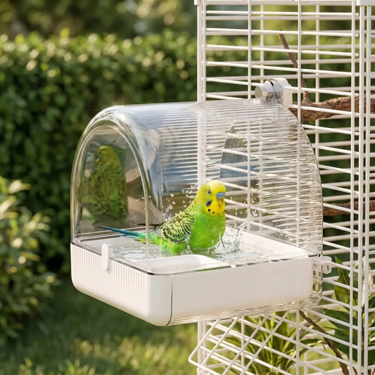 Green and yellow budgerigar splashing in the bath, which hangs on a white cage in a sunny garden. 2