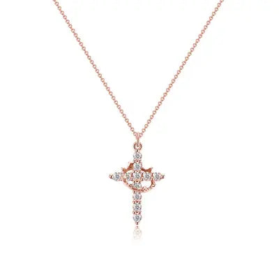 Rose gold-tone crystal cross pendant on a slim chain, photographed flat on white to show the crown detail. 7