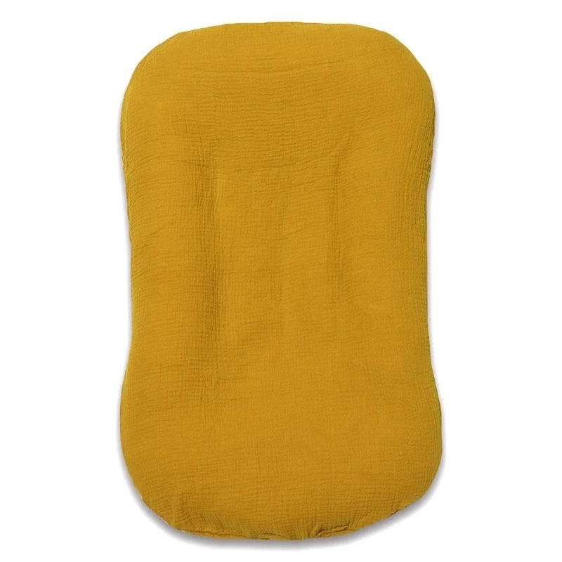 Empty mustard yellow lounger with crinkled fabric, shown flat from above 11
