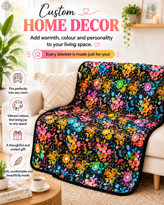 Blanket coloured in with bright flowers and butterflies, draped over a cream sofa in a living room 2
