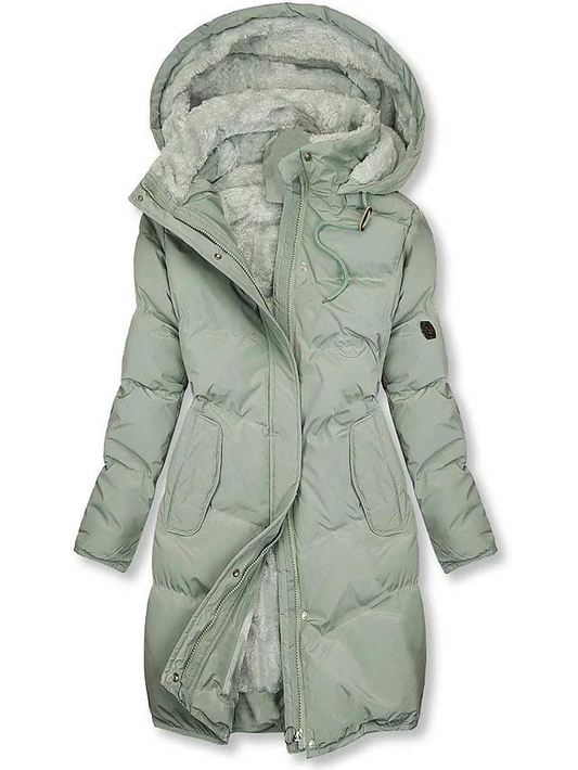Pale sage green version of the quilted hooded coat, zip partly undone to reveal grey-green fleece lining and the drawstring collar. 2