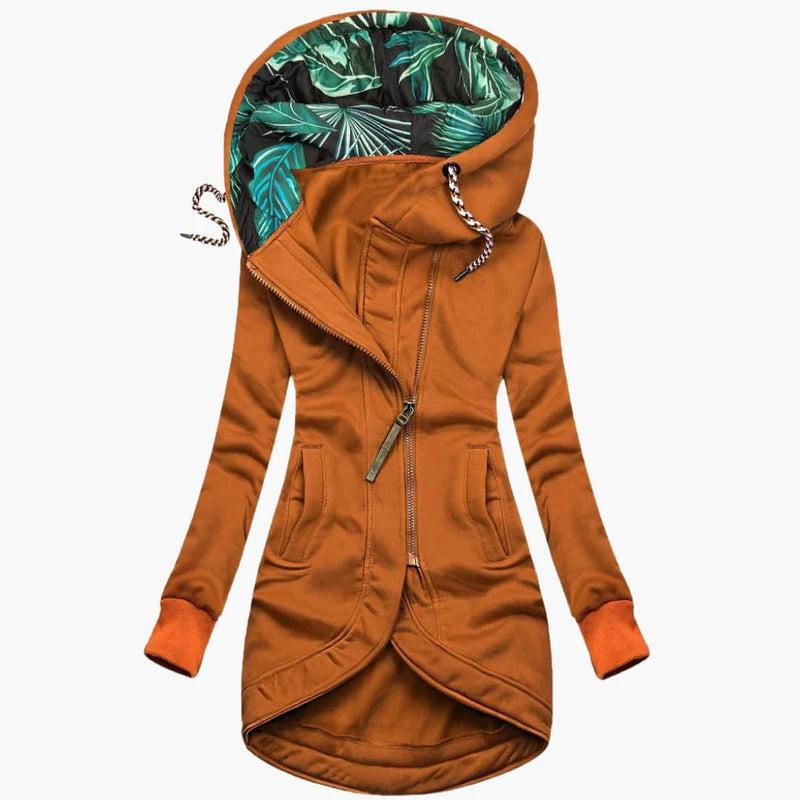 Rust orange version of the long hooded jacket, with matching ribbed cuffs, a metal zip pull and leaf-print hood lining. 6