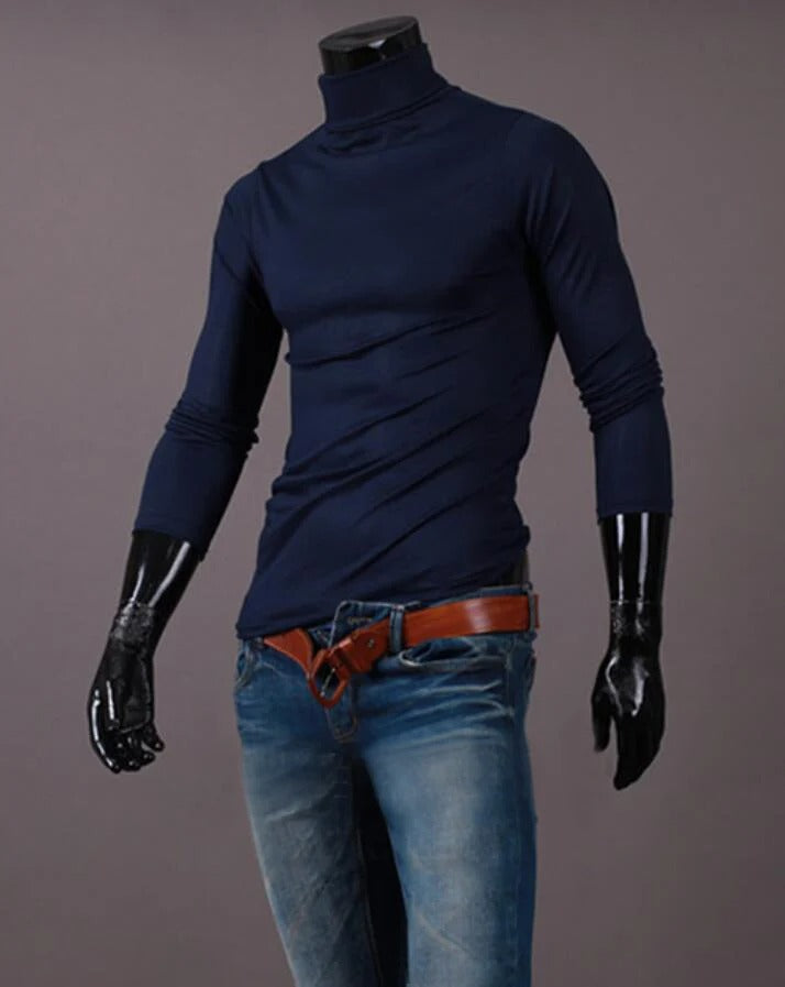 Navy high neck top on a headless mannequin, styled with blue jeans and a tan belt 13