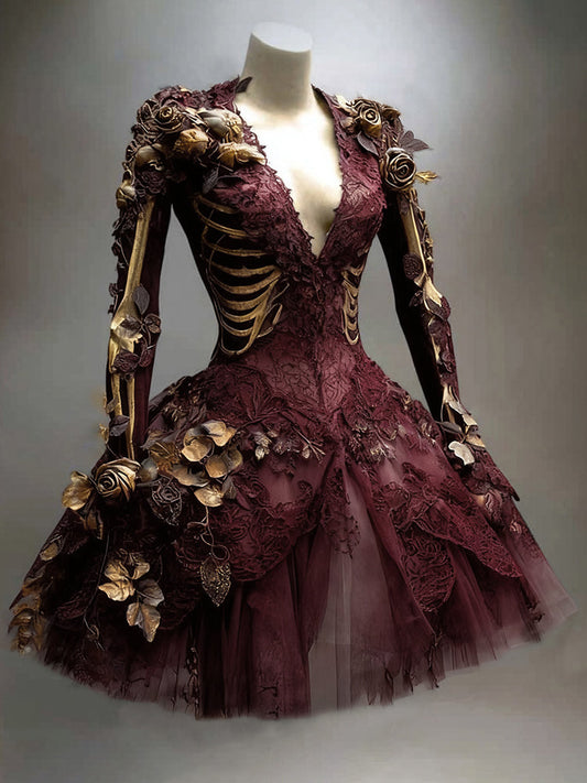 Burgundy version of the long-sleeved lace and tulle dress on a mannequin, with gold rib-cage print and roses. 2