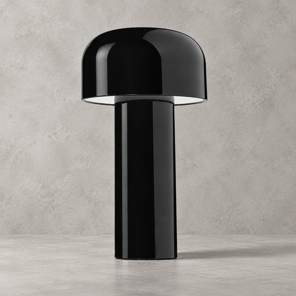 Glossy black lamp with domed shade, close view against a concrete-effect wall 33