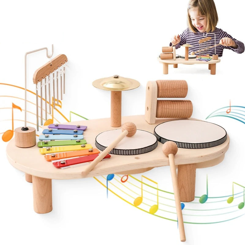 Full music set with two mallets in front, colourful music notes behind and a girl playing in an inset 11