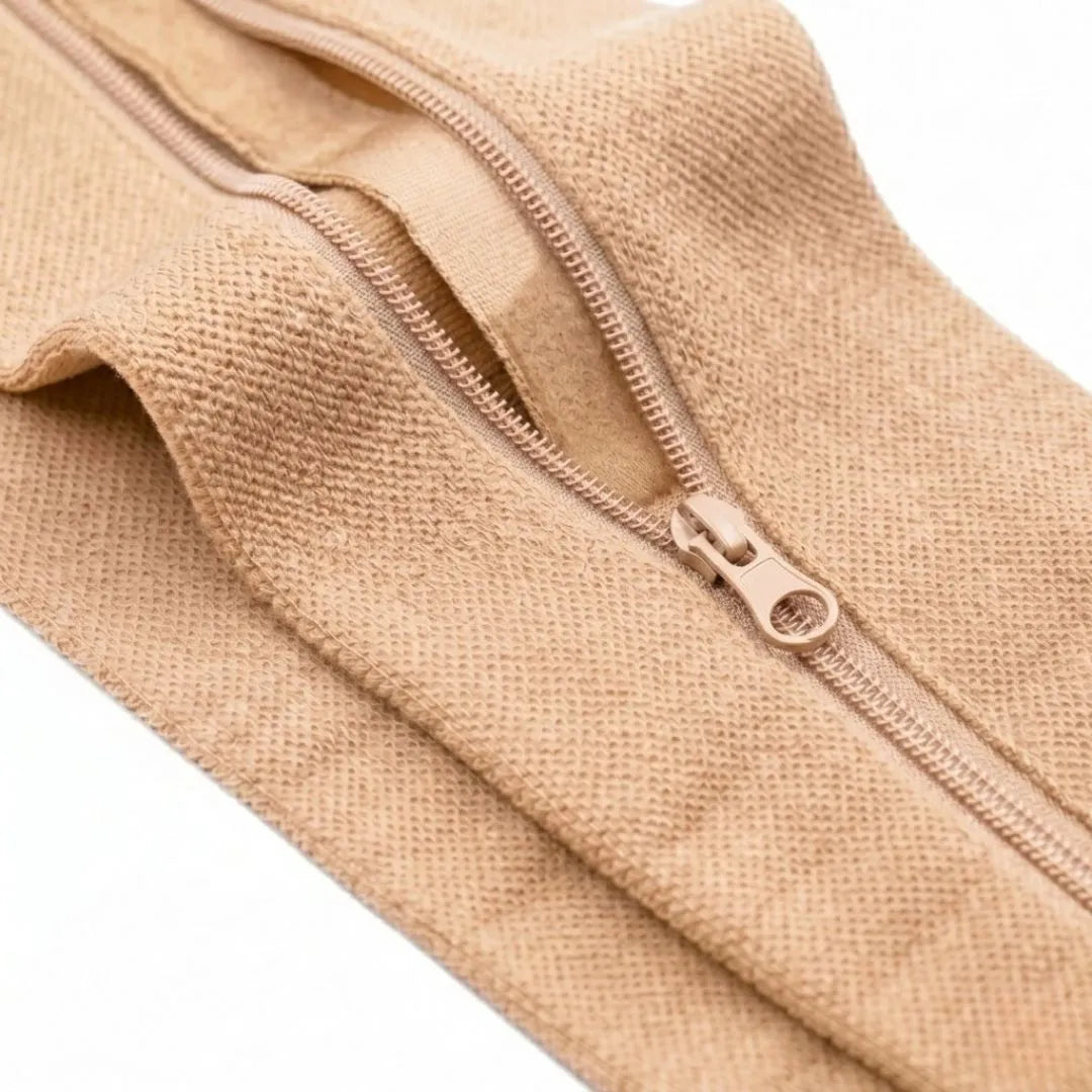 Close-up of the beige stocking's partly open zip, showing the knitted texture and soft lining 13