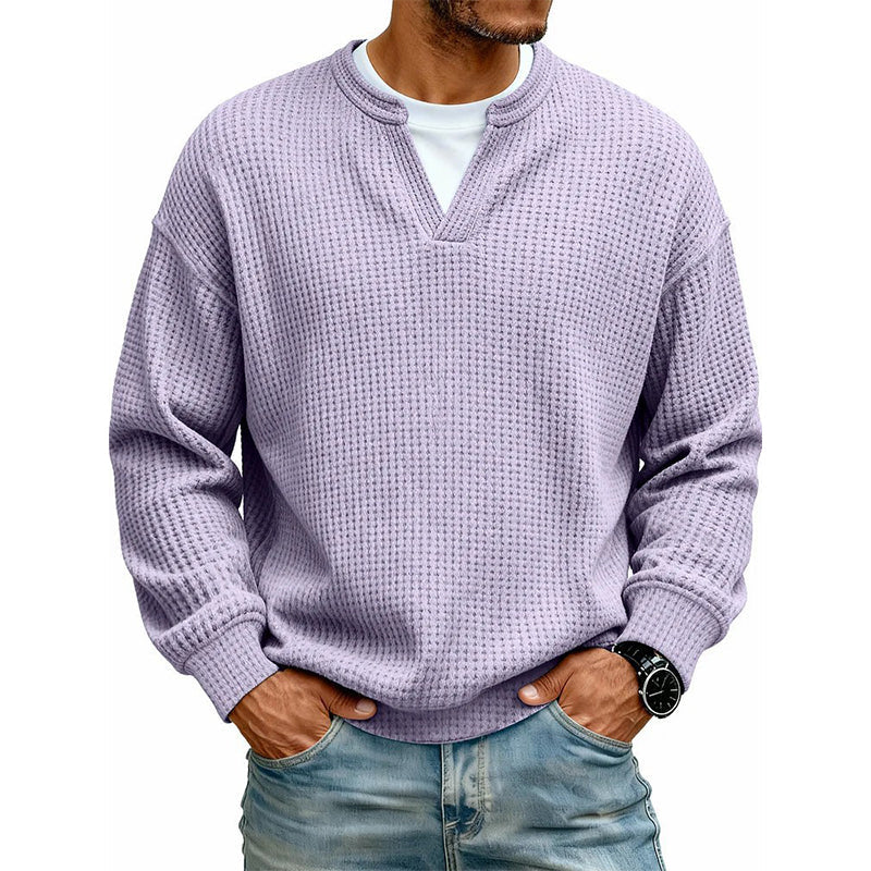 Front view of the waffle knit V-neck top in lilac, worn over a white tee with light jeans. 19