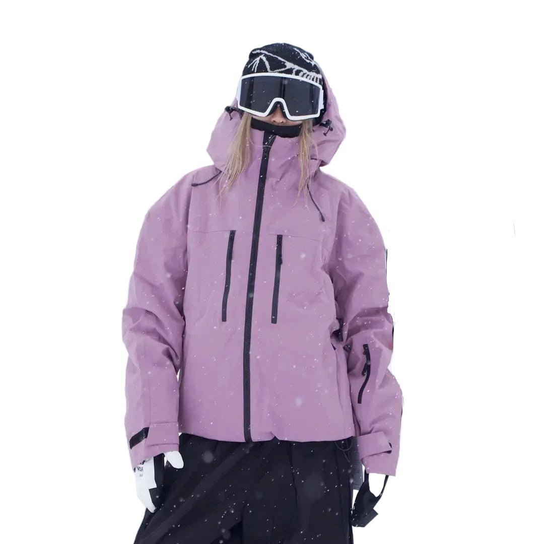 Full front view of the pink-purple jacket on a model, hood up, showing the central zip, chest pockets and adjustable cuffs. 4