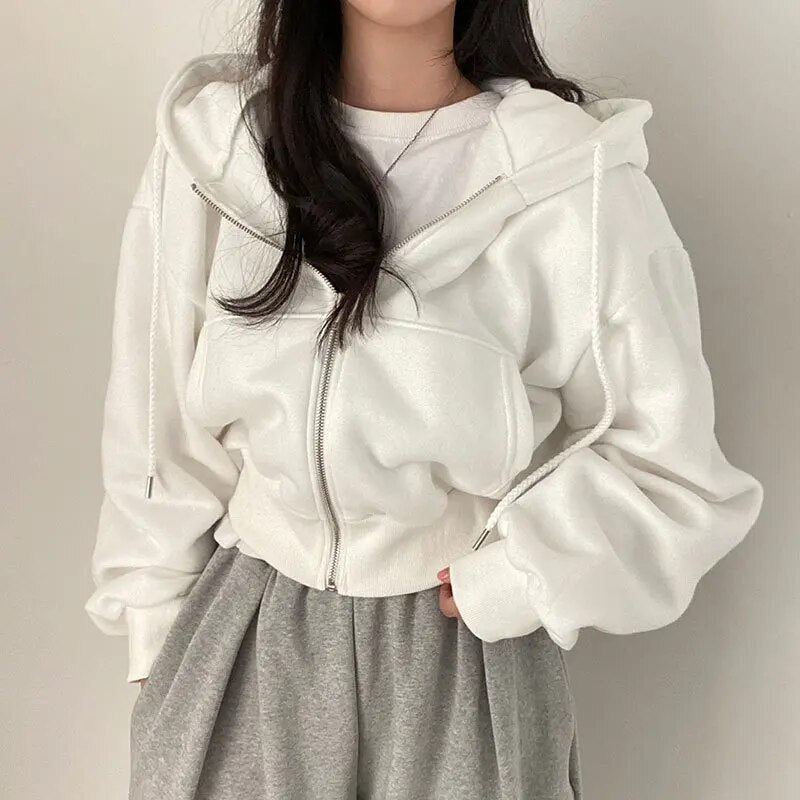 Ladies' short-cut vest with hood and oversized fit – Rinette