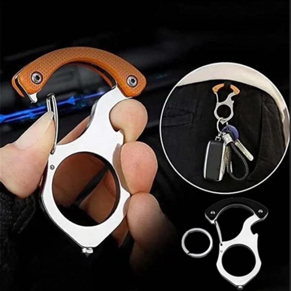 Orange-handled carabiner held in the hand, with an inset showing it clipped to a trouser pocket carrying a car key fob and keys. 2