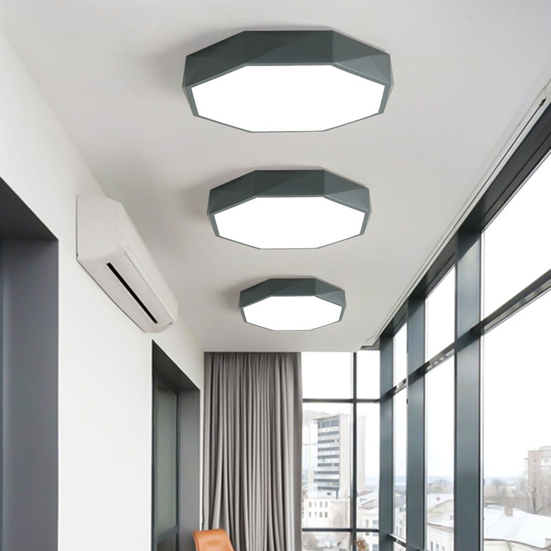 Three grey octagonal ceiling lights in graduated sizes along a hallway with tall windows and a wall-mounted air conditioner 2