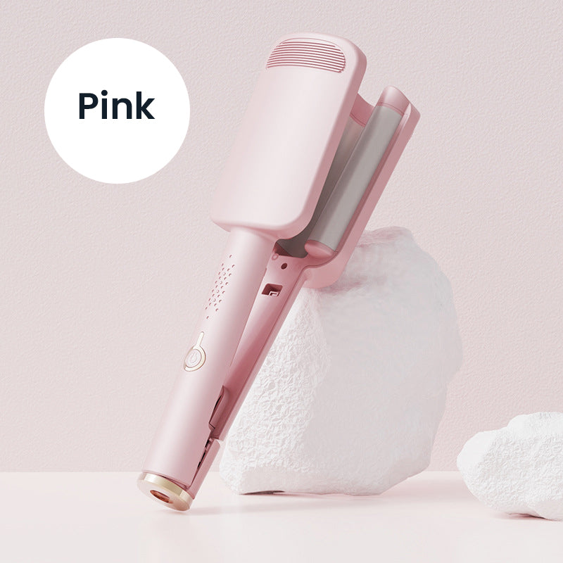 Pink wave iron propped against a white rock, with the open wavy plates visible 9