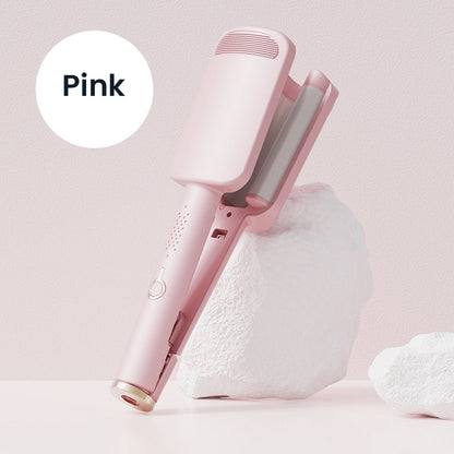 Pink wave iron propped against a white rock, with the open wavy plates visible 9