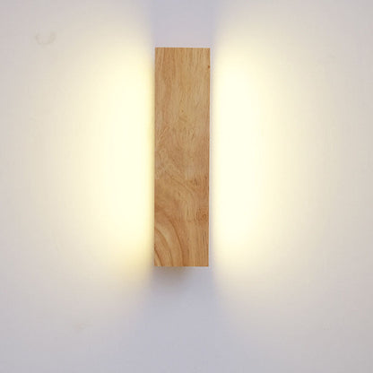 Front view of the wooden bar mounted vertically, with warm light spilling onto the wall on both sides. 3