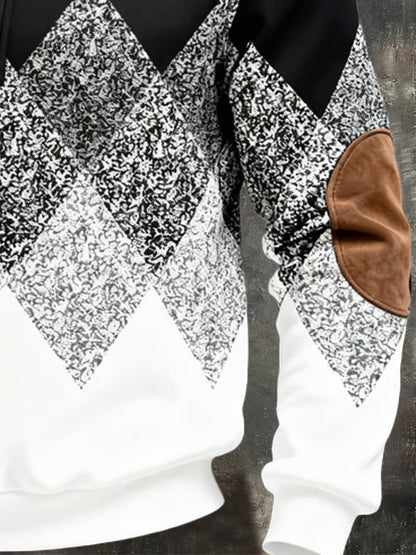 Close-up of the black and white speckled diamond pattern, ribbed hem and tan elbow patch 4