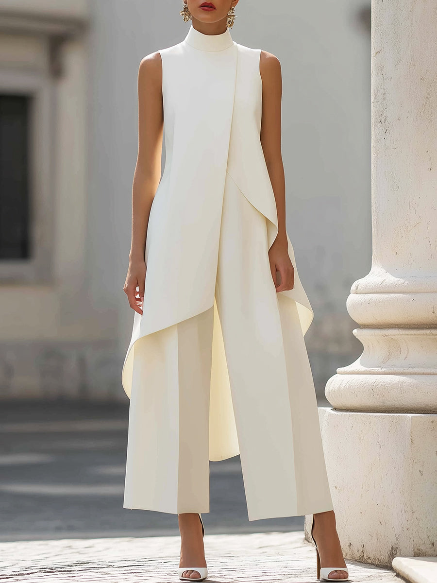 Front view in cream on a model beside a stone column, showing the sleeveless high-neck top over wide-leg trousers. 3