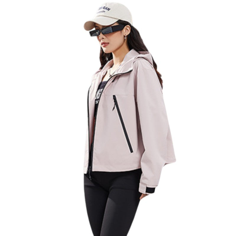 Side view of the pale pink jacket worn unzipped over a dark top, showing a diagonal pocket zip 11