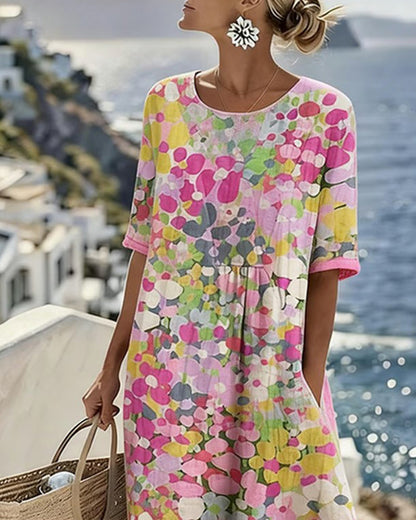 Upper-body detail of the pink floral dress showing round neckline, gathered waist and short sleeves 3