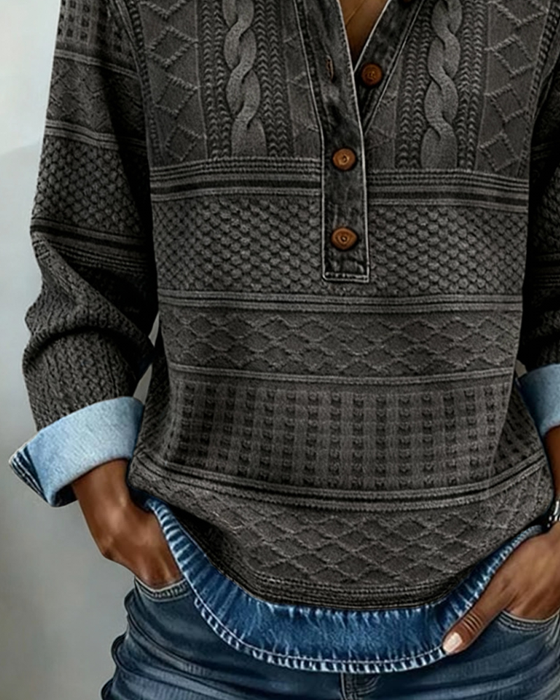 Close-up of the grey jumper's buttons and textured knit, with the light denim cuff and hem showing 5