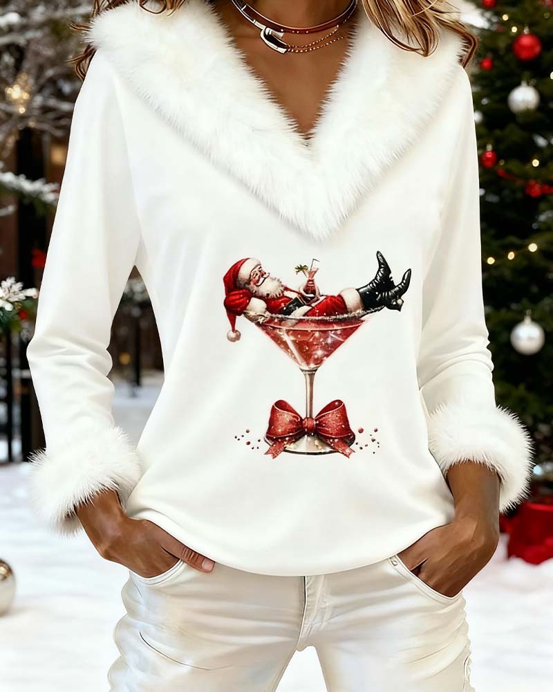 White top worn outdoors in front of a snowy Christmas tree with baubles 6