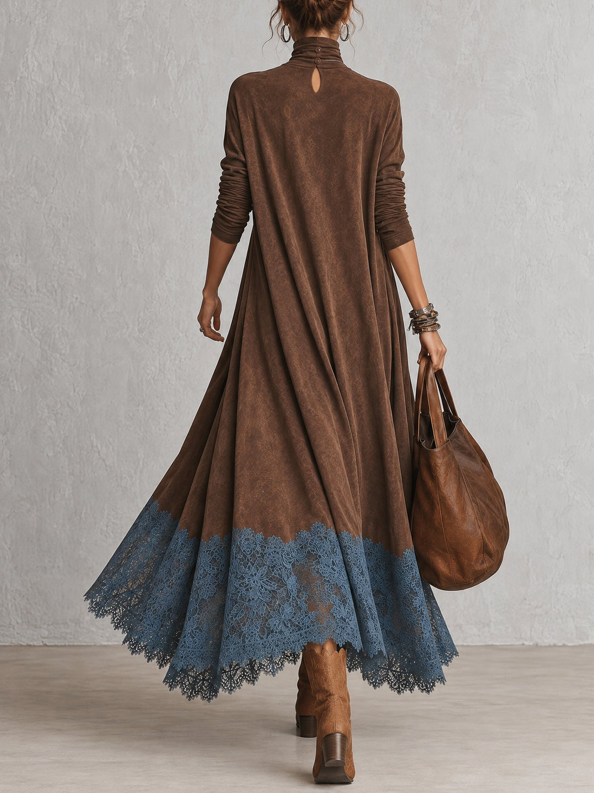 Back view of the brown dress showing a keyhole opening at the neck and blue lace hem 10