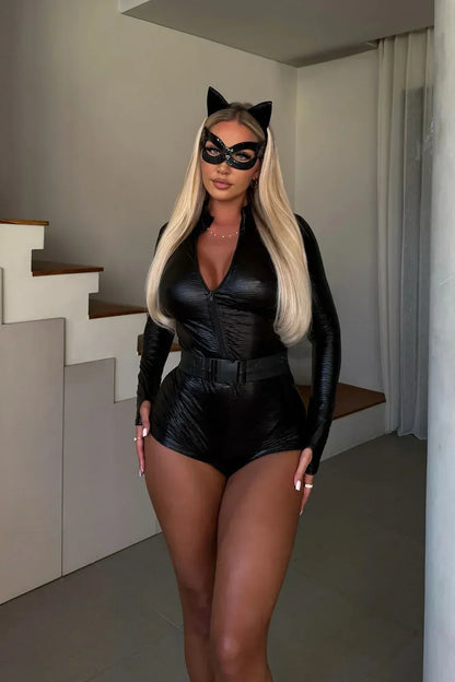 Model with long blonde hair standing indoors in the full costume with mask, ears and belt 6