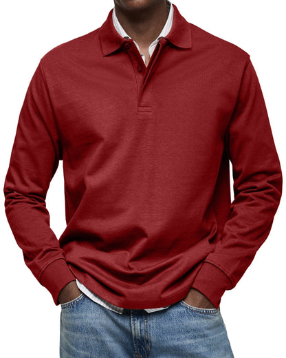 Front view of the polo in deep red on a model, three-button placket and ribbed cuffs, with jeans. 11