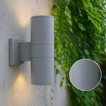 Grey cylindrical wall light mounted on a rendered wall beside ivy, with a close-up inset of raindrops on its textured surface. 5
