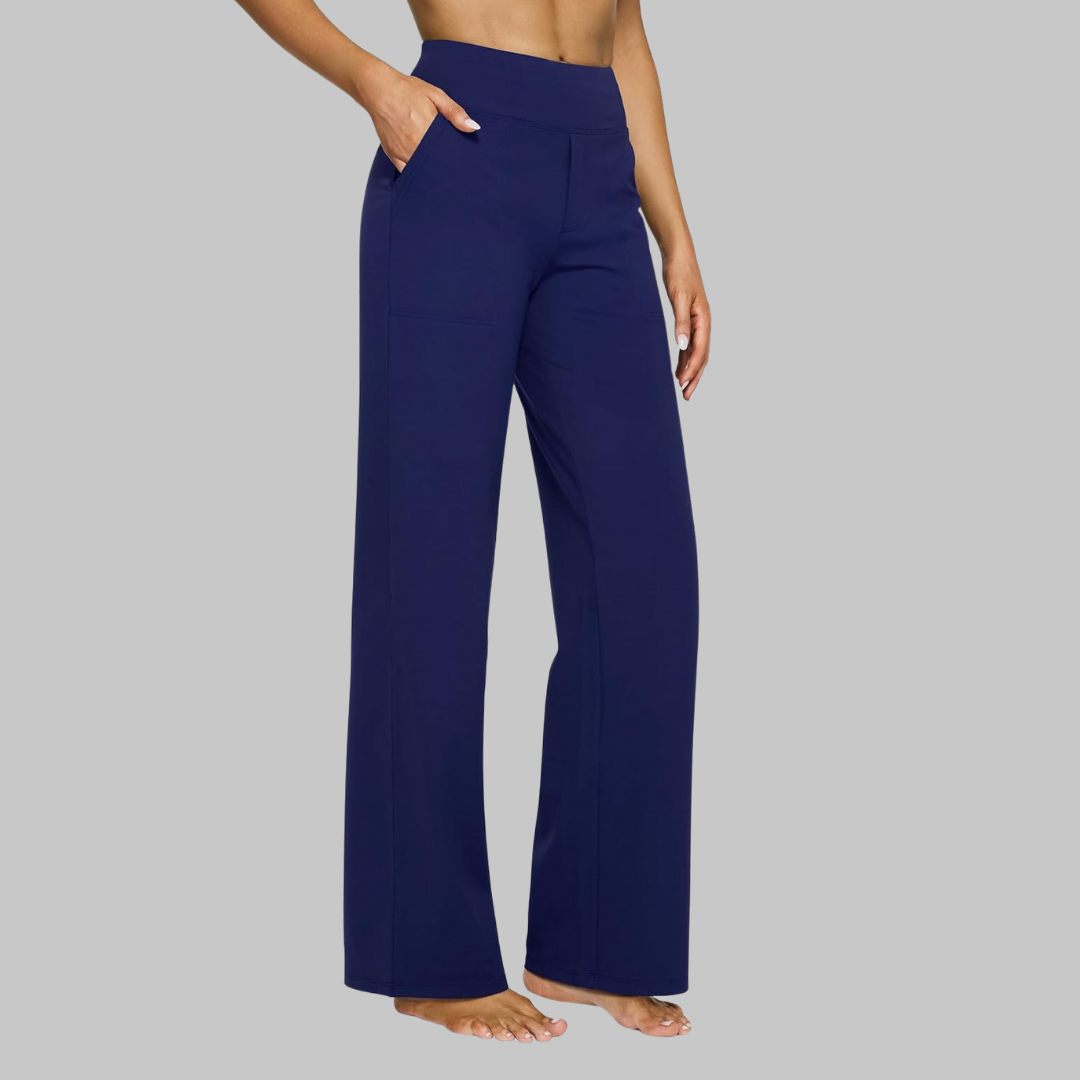 Navy blue version of the high-waist straight-leg trousers, side view with patch pocket and hand in pocket. 12