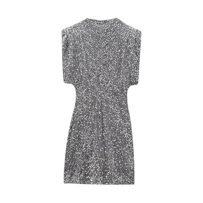 Back view of the grey sequinned mini dress laid flat, with gathered seams across the back 10