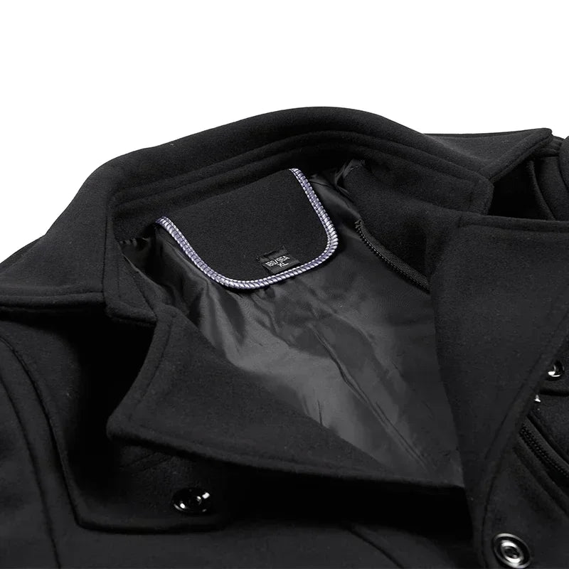 Close-up of the black coat's collar turned back to show the lining and a contrast-edged neck label 10
