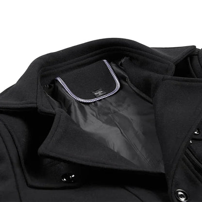 Close-up of the black coat's collar turned back to show the lining and a contrast-edged neck label 10
