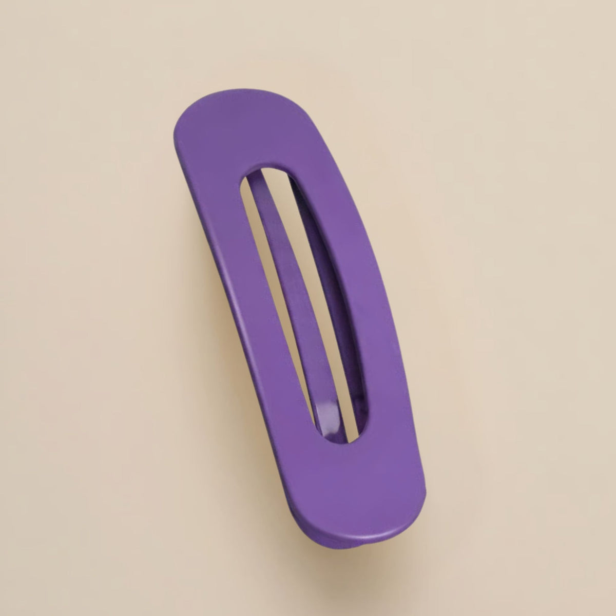Matte purple slim flat clip with a long open slot on a beige background 11
