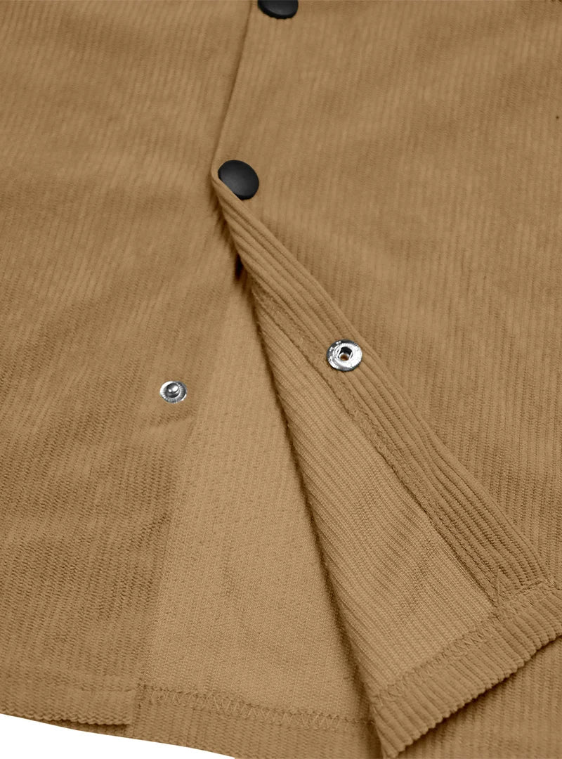 Close-up of the tan shirt's placket turned back, showing black buttons and metal snap fasteners 11