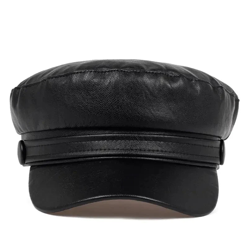 Black baker boy hat from the front, showing the layered band, side buttons and curved peak 11