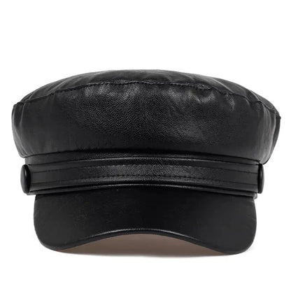 Black baker boy hat from the front, showing the layered band, side buttons and curved peak 11
