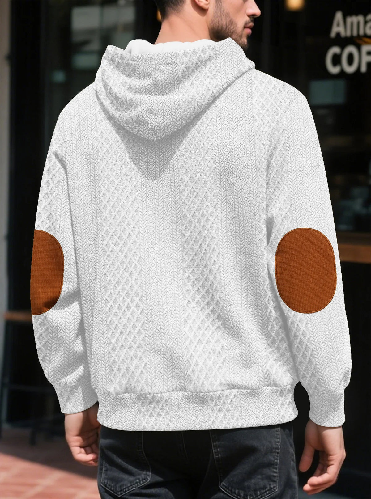 Back view of a white textured hoodie worn outdoors, showing large tan elbow patches and the hood 11