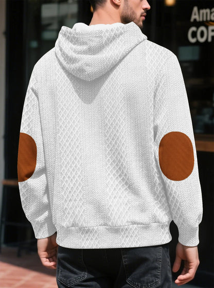 Back view of a white textured hoodie worn outdoors, showing large tan elbow patches and the hood 11